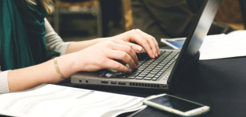 Woman working on Galaxkey's secure workspace working collaboratively with her team